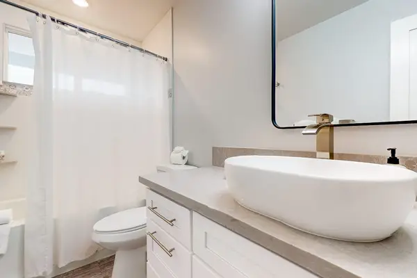 Guest bedroom with tub/shower combo.
