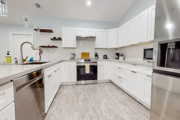 A well-appointed kitchen boasts modern appliances,  create hearty breakfasts or quick snacks with ease.