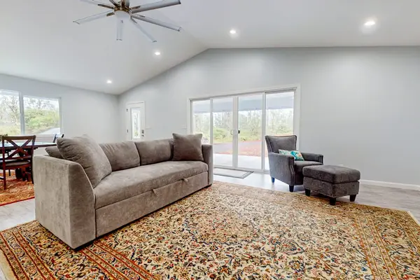 Open concept living with a sofa bed for any extra guests that stop by and a flat screen tv.