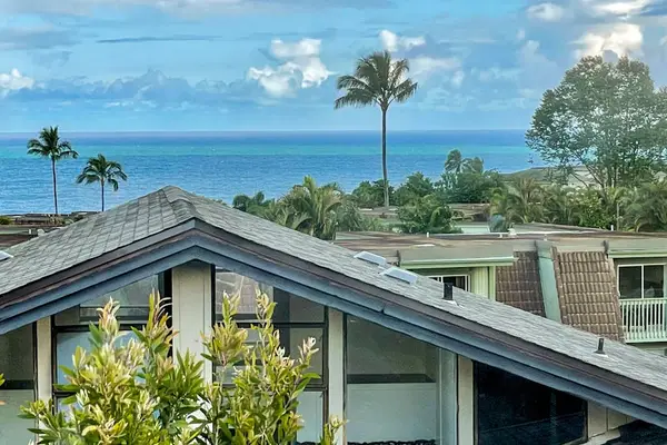 Views of the Pacific Ocean with palm trees swaying in the fresh ocean breezes.
