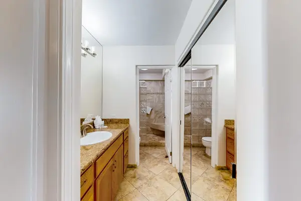 This bathroom features traditional wood-toned cabinetry.