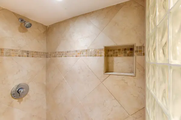 Walk-in shower with elegant tile finishes