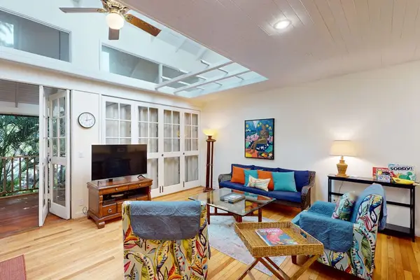 Charming island layout presents thoughtful details for easy guest stays