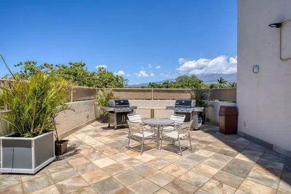 Outdoor BBQ area with patio seating