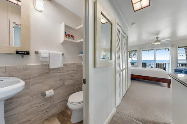 Full bathroom with a walk-in shower and modern finishes.