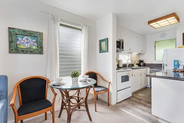 Cozy dining area adjacent to the fully equipped kitchen.