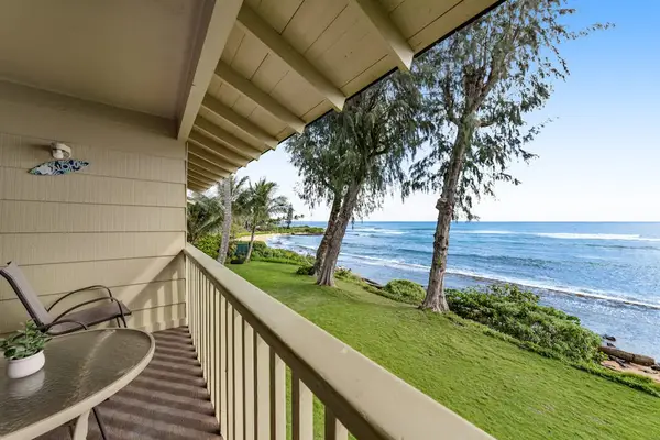 Private lanai with comfortable seating and panoramic ocean views.