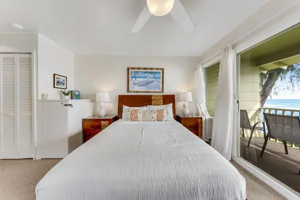 Comfortable bedroom with direct access to the private oceanfront lanai.