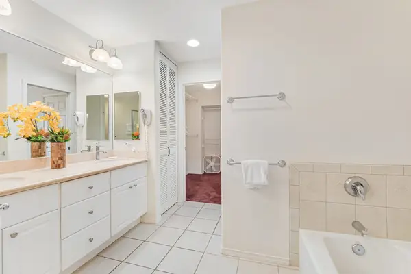 Master bedroom with double sinks, garden tub and walk in shower.