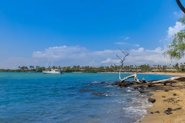 Turquoise waters crashing on to the white sandy beaches.