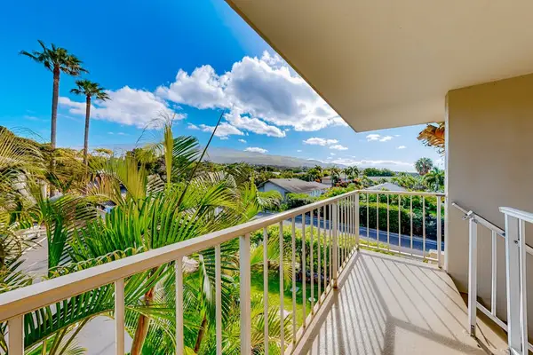 Balcony featuring lush tropical scenery.