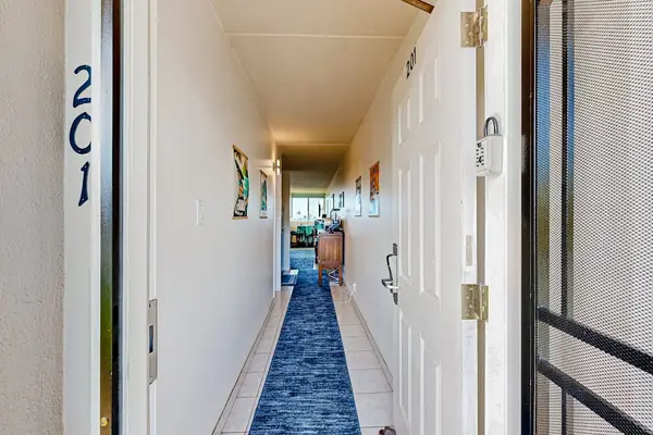 Entryway to the unit with an interior hallway.