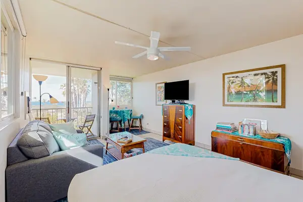 This cozy living room features a comfortable blue sofa and aesthetic views.