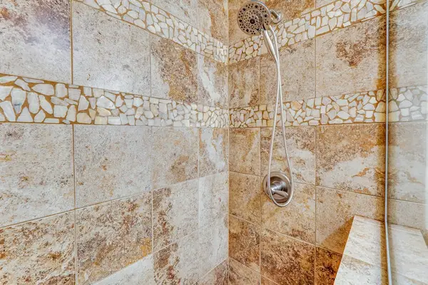 Refresh in the Beautiful Stone Walk-In Shower