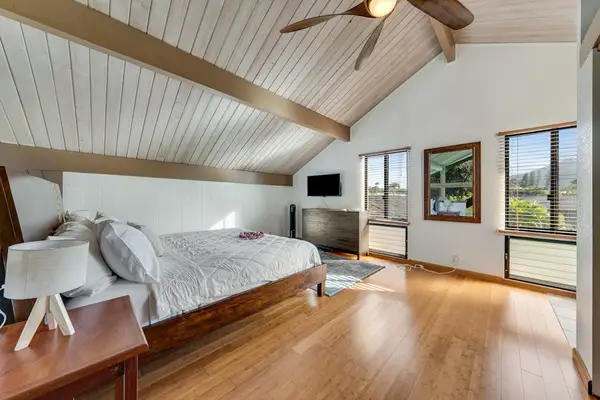 Vaulted suite offers cushioned seating television bright island inspired charm