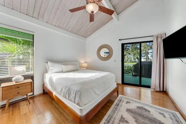 French doors invite morning air across welcoming timber floors indoors
