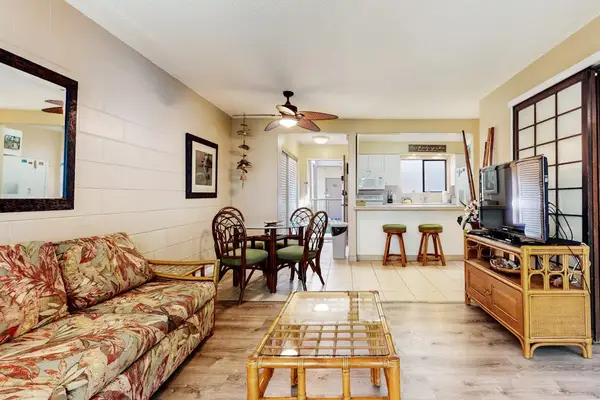Open airy living room with flat screen tv and a pull out sofa for extra guests.