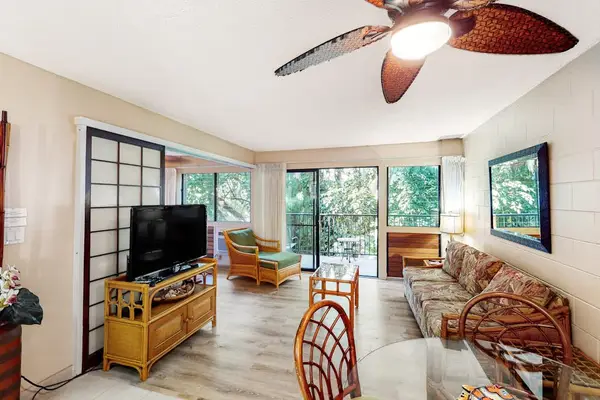 Open airy living room with flat screen tv and a pull out sofa for extra guests.