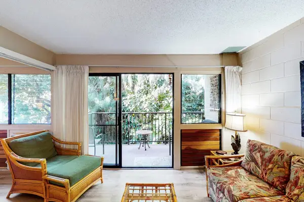 Open airy living room with flat screen tv and a pull out sofa for extra guests.