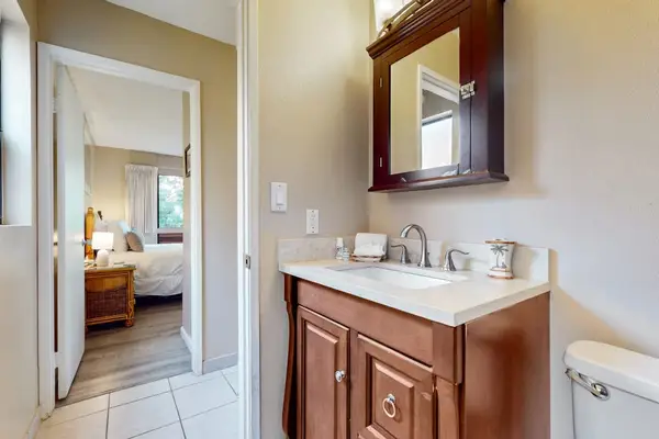 Newly update bathroom remodel with a walk in tiled shower and updated fixtures.