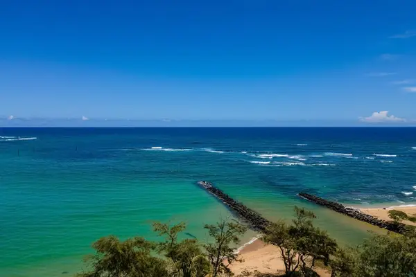 Gaze out over the crashing waves on to the white sandy beaches.