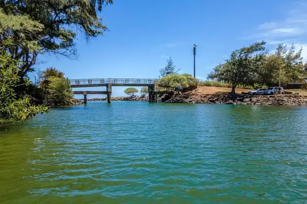 Pono Kai Resort, includes 12-acre grounds, an outdoor pool, a hot tub, a shuffleboard area, a barbecue facility with gas grills, a sauna, golf putting greens, Ping-Pong tables, a croquet lawn, a fitness center, tennis courts, and laundry facilities.