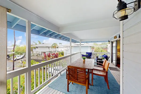 Beautiful covered balcony featuring a wooden dining set, stylish outdoor rug, and bright open-air layout for ultimate relaxation! 🍽️✨
