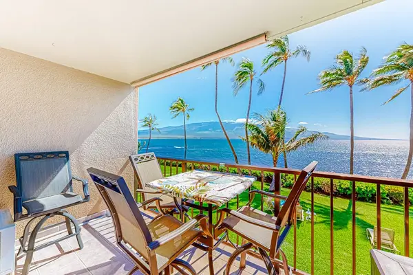 Lanai with seating with marvelous views of the turquoise blue waters of the Pacific and watching the Palm Trees swaying in the breeze.