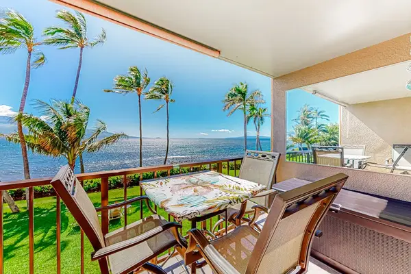Lanai with seating with marvelous views of the turquoise blue waters of the Pacific and watching the Palm Trees swaying in the breeze.