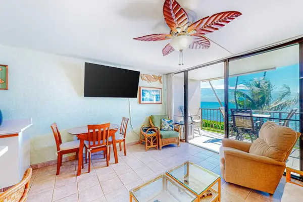 Living room with lots of natural light and an open concept feel with a flatscreen tv.