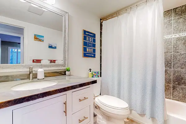 Guest bathroom with a tub/shower combo.