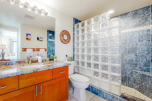 Master bathroom with large walk in tile shower.