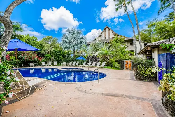 Resort pool surrounded by tropical scenery