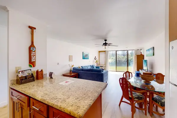 A bright, sunlit kitchen where warmth meets comfort.
