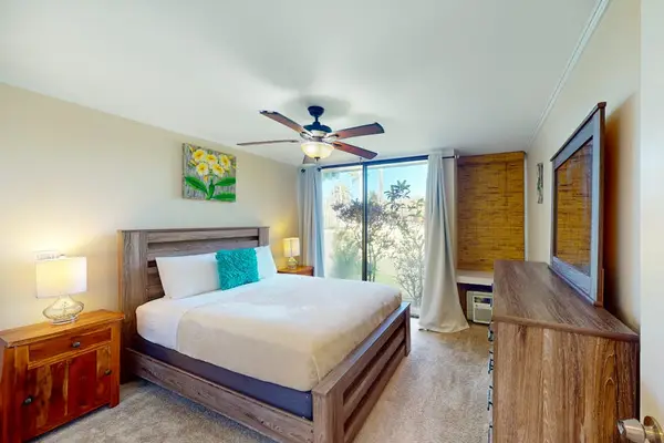 A bright bedroom with warm touches that make every stay feel special