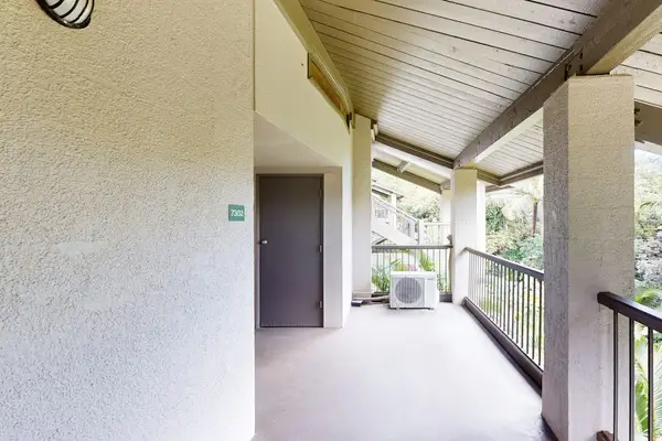 Covered hallway offers easy access throughout the peaceful tropical property
