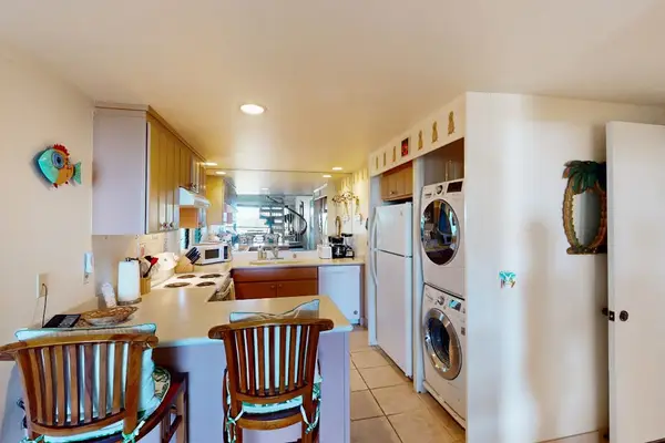 Enjoy casual meals beside the bright and well-equipped kitchen area