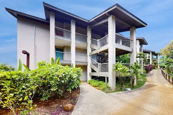 Welcoming property exterior surrounded by lush greenery and island charm