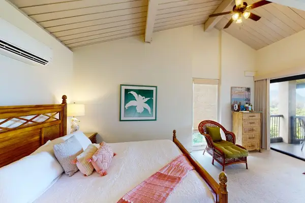 Relax in this bright bedroom after another memorable island day