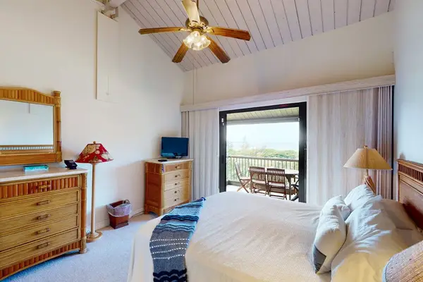 Wake up refreshed in this peaceful bedroom with outdoor views