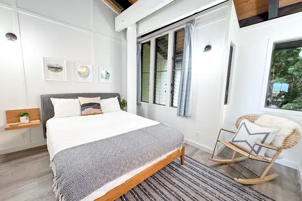 Third Bedroom offers cozy bed rocking chair and peaceful views