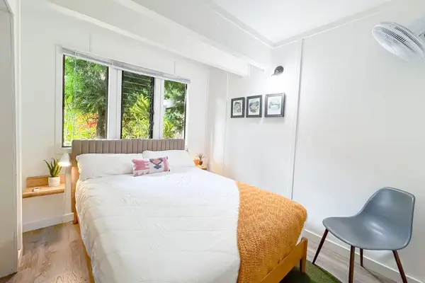 Second Bedroom brings crisp linens woodland views and simple relaxing style