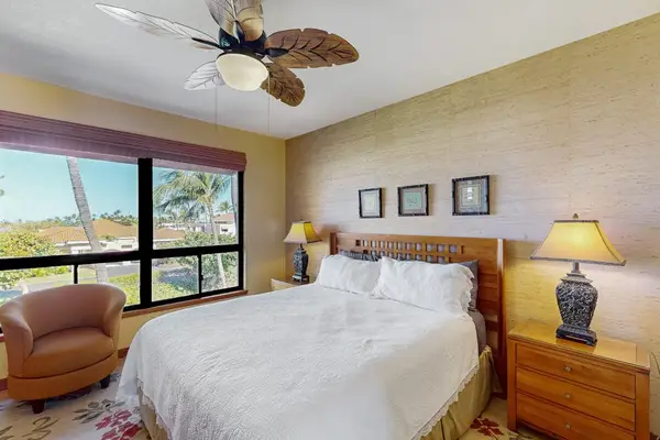 Bright Primary Suite with King Bed, Tropical Ceiling Fan & Ocean-Breeze Windows