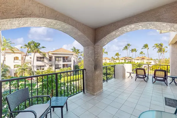Covered Arched Balcony with Seating & Resort Views