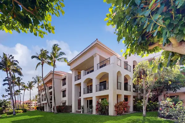 Lush Exterior Grounds with Tropical Landscaping & Arched Mediterranean Architecture