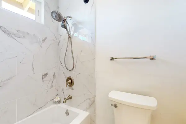Guest bath with tub/shower combo.