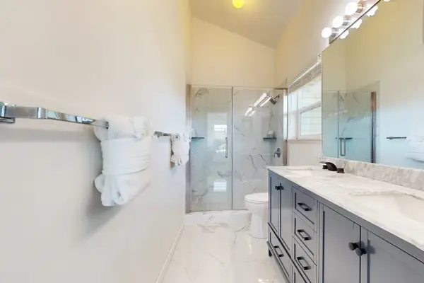 Newly remodeled master bathroom with double sinks and amazing tiled walk-in shower.