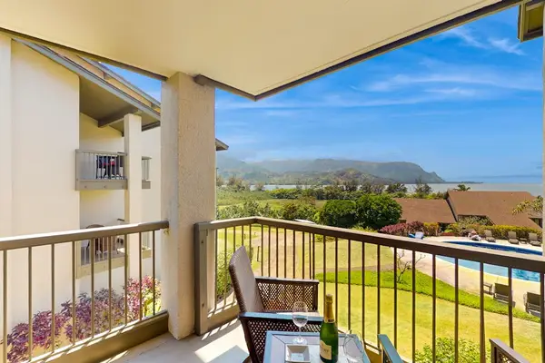 Covered balcony provides seating, mountain views, and refreshing island breezes
