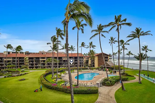 Take in sweeping views of the resort grounds, pool, and ocean beyond.
