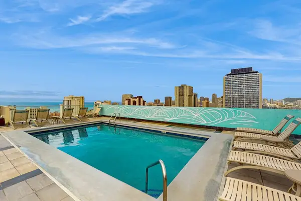 Rooftop swimming pool overlooking Waikiki skyline